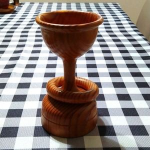 Decorative wooden cup encircled with the wooden ring that is not removable